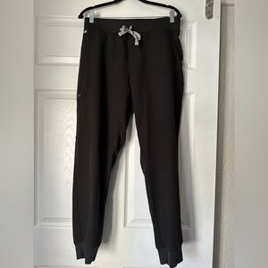 Gently used Figs scrubs in black.